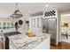 Open kitchen with granite island, stainless appliances, and seamless flow to the breakfast nook at 1183 Woods Ne Cir, Atlanta, GA 30324