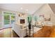 Bright living room with high ceilings, a fireplace, and access to the outdoors at 1183 Woods Ne Cir, Atlanta, GA 30324