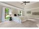 Bright primary bedroom features large windows, tray ceilings, and modern light fixtures at 1183 Woods Ne Cir, Atlanta, GA 30324