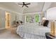 Bright primary bedroom features tray ceilings, dual windows, and plush carpeting at 1183 Woods Ne Cir, Atlanta, GA 30324