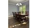 Dining room with a chandelier and large windows that bring in natural light at 1462 Knights Trl, Stone Mountain, GA 30083