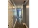 Hallway featuring gray walls, white trim, and wood-look floors at 1462 Knights Trl, Stone Mountain, GA 30083