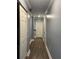Hallway featuring gray walls, white trim, and wood-look floors at 1462 Knights Trl, Stone Mountain, GA 30083