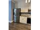 Kitchen featuring stainless steel appliances and white cabinetry at 1462 Knights Trl, Stone Mountain, GA 30083
