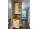Living area with hardwood floors and a storage space at 1462 Knights Trl, Stone Mountain, GA 30083