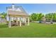 Spacious backyard with a covered outdoor area, seating, and a playground at 3909 Obryant Se Cir, Smyrna, GA 30082