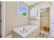 Bright bathroom with a soaking tub and a separate tiled shower area at 3909 Obryant Se Cir, Smyrna, GA 30082