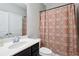 Neutral bathroom featuring a shower and tub combo, single vanity and decorative shower curtain at 3909 Obryant Se Cir, Smyrna, GA 30082
