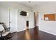Empty room featuring hardwood floors, rocking chair and access to an ensuite bathroom at 3909 Obryant Se Cir, Smyrna, GA 30082