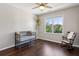 Bedroom with a crib, rocking chair, hardwood floors and neutral walls at 3909 Obryant Se Cir, Smyrna, GA 30082