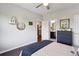 Bedroom featuring hardwood floors, neutral walls, and decorative wall hangings and access to ensuite at 3909 Obryant Se Cir, Smyrna, GA 30082
