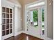 Bright foyer featuring hardwood floors and a view of the front door with sidelights at 3909 Obryant Se Cir, Smyrna, GA 30082
