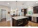 Well-lit kitchen with a center island, stainless steel appliances, and a view to the dining area at 3909 Obryant Se Cir, Smyrna, GA 30082