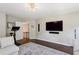 Bright, open living room featuring a wall-mounted TV, and a staircase at 3909 Obryant Se Cir, Smyrna, GA 30082