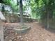 Serene backyard featuring a covered patio, mature trees, and a tranquil setting at 646 Darlington Ne Cir, Atlanta, GA 30305
