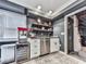 Stylish bar area complete with sink, shelving, beverage fridge, and popcorn machine, perfect for entertaining at 646 Darlington Ne Cir, Atlanta, GA 30305