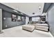 Finished basement featuring a large sectional, projector, and movie posters for a fun entertaining space at 646 Darlington Ne Cir, Atlanta, GA 30305