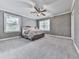 Spacious bedroom featuring two windows, neutral gray walls, white trim, and a ceiling fan at 646 Darlington Ne Cir, Atlanta, GA 30305