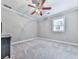Bedroom with gray walls, white trim, carpeting, and a window overlooking the backyard at 646 Darlington Ne Cir, Atlanta, GA 30305