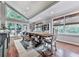 Dining area with a large table, and bench seating, adjacent to large windows with natural light at 646 Darlington Ne Cir, Atlanta, GA 30305