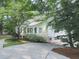 Quaint, single-story home with a covered porch, lush landscaping, and a welcoming entrance at 646 Darlington Ne Cir, Atlanta, GA 30305