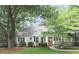 Charming single-story home with mature trees, manicured lawn, and inviting front entrance at 646 Darlington Ne Cir, Atlanta, GA 30305