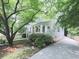 Charming home with a white picket fence, inviting porch, and a well-manicured lawn at 646 Darlington Ne Cir, Atlanta, GA 30305