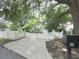 Charming home with a white picket fence and mature trees, creating a welcoming curb appeal at 646 Darlington Ne Cir, Atlanta, GA 30305