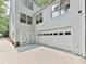 Well-maintained attached garage with a white door and large driveway, providing ample parking and storage at 646 Darlington Ne Cir, Atlanta, GA 30305