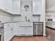 Modern kitchen featuring stainless steel appliances, granite countertops, farmhouse sink, and stylish backsplash at 646 Darlington Ne Cir, Atlanta, GA 30305