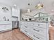 Spacious kitchen featuring a large island, modern appliances, and a seamless flow into the living and dining areas at 646 Darlington Ne Cir, Atlanta, GA 30305