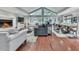 Open-concept living area featuring a fireplace, hardwood floors, and a vaulted ceiling at 646 Darlington Ne Cir, Atlanta, GA 30305