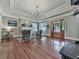Living room with hardwood floors, decorative ceilings, natural light, fireplace, and a seamless flow to other living spaces at 646 Darlington Ne Cir, Atlanta, GA 30305