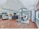 Open-concept living and dining area with hardwood floors, fireplace, and bright natural light at 646 Darlington Ne Cir, Atlanta, GA 30305