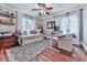 A brightly lit home office with modern furnishings and hardwood flooring and shelving at 646 Darlington Ne Cir, Atlanta, GA 30305