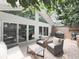 Relaxing outdoor patio with comfortable seating, a grill, and sliding glass doors to the home at 646 Darlington Ne Cir, Atlanta, GA 30305