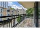 Balcony with tiled floor and black railing, offering outdoor seating overlooking the neighborhood at 1130 Piedmont Ne Ave # 402, Atlanta, GA 30309