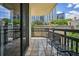 Balcony featuring tile flooring and black metal railing with cityscape views at 1130 Piedmont Ne Ave # 402, Atlanta, GA 30309