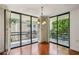 Living area with multiple windows leading to spacious balcony with outdoor seating at 1130 Piedmont Ne Ave # 402, Atlanta, GA 30309