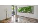 Bedroom with tile flooring and large windows with a view of trees at 1130 Piedmont Ne Ave # 402, Atlanta, GA 30309