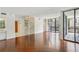 Bright living room boasts hardwood floors, spiral staircase, and a sliding glass door to a balcony at 1130 Piedmont Ne Ave # 402, Atlanta, GA 30309