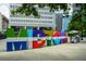 Midtown sign with rainbow umbrella and snack vendor at 1130 Piedmont Ne Ave # 402, Atlanta, GA 30309
