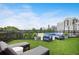 A relaxing roof deck with artificial turf and comfortable seating and a stunning skyline view at 1130 Piedmont Ne Ave # 402, Atlanta, GA 30309