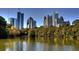 Scenic view of the Atlanta skyline, featuring the buildings reflected on the lake at 1130 Piedmont Ne Ave # 402, Atlanta, GA 30309