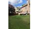 Expansive backyard with green lawn, patio set, basketball hoop, and privacy fence surrounding the property at 1450 Liberty Ln, Cumming, GA 30040