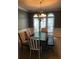Charming dining room with a large table, stylish chairs, and beautiful natural light at 1450 Liberty Ln, Cumming, GA 30040
