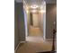 Carpeted hallway with decorative crown molding and recessed lighting, connecting various rooms in the home at 1450 Liberty Ln, Cumming, GA 30040