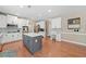 Stylish eat-in kitchen with a large island, stainless steel appliances, and hardwood floors at 1450 Liberty Ln, Cumming, GA 30040