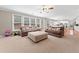 Spacious living room featuring neutral colors, plush sofas, and large windows offering plenty of natural light at 1450 Liberty Ln, Cumming, GA 30040