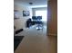 Dedicated office space with dual monitors on a desk, complemented by home gym equipment at 1450 Liberty Ln, Cumming, GA 30040